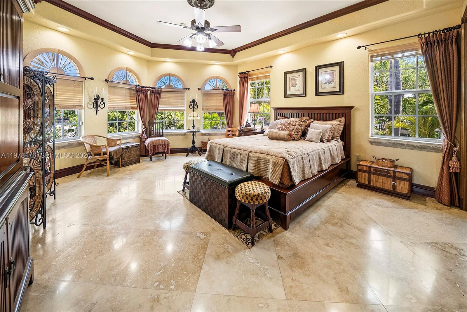 4501 North Bay Road Miami Beach, FL 33140 - Photo 23 of 24 a spacious bedroom with a bed and a large window