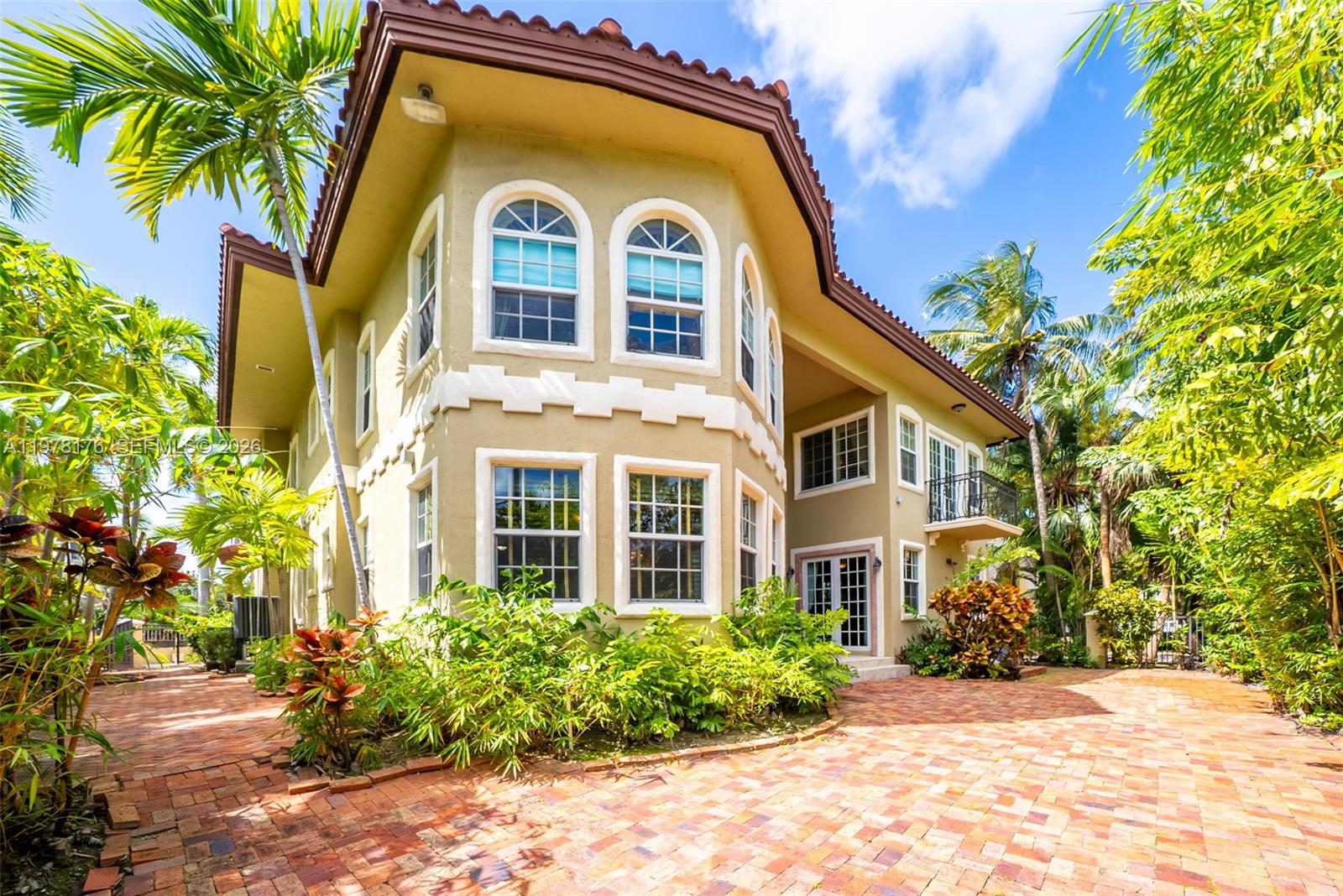 4501 North Bay Road Miami Beach, FL 33140 - Photo 3 of 24 a front view of a house with a garden