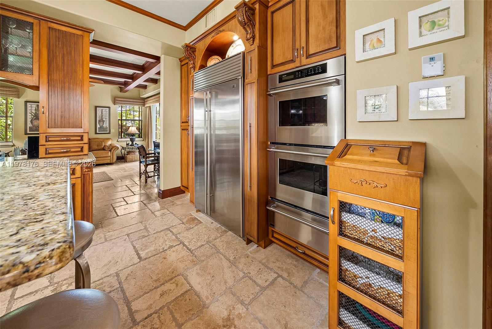 4501 North Bay Road Miami Beach, FL 33140 - Photo 5 of 24 a kitchen with stainless steel appliances granite countertop a refrigerator and a stove