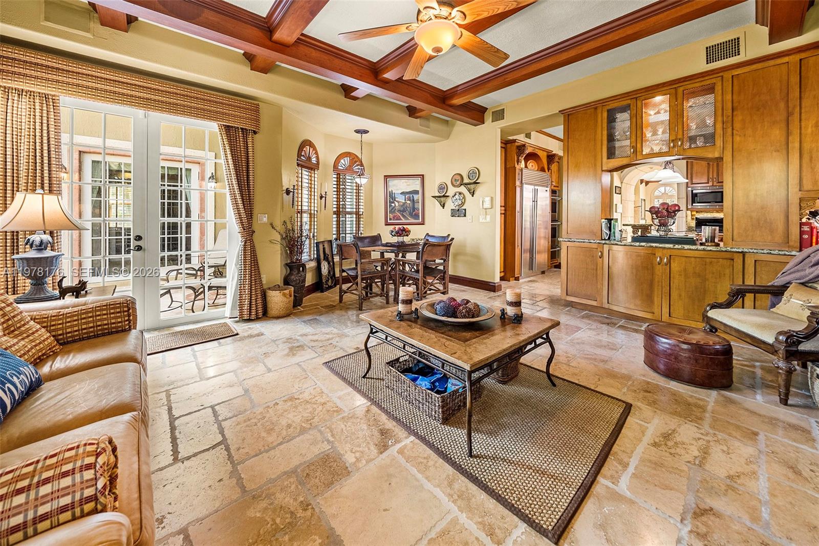 4501 North Bay Road Miami Beach, FL 33140 - Photo 7 of 24 a living room with furniture a rug and a table