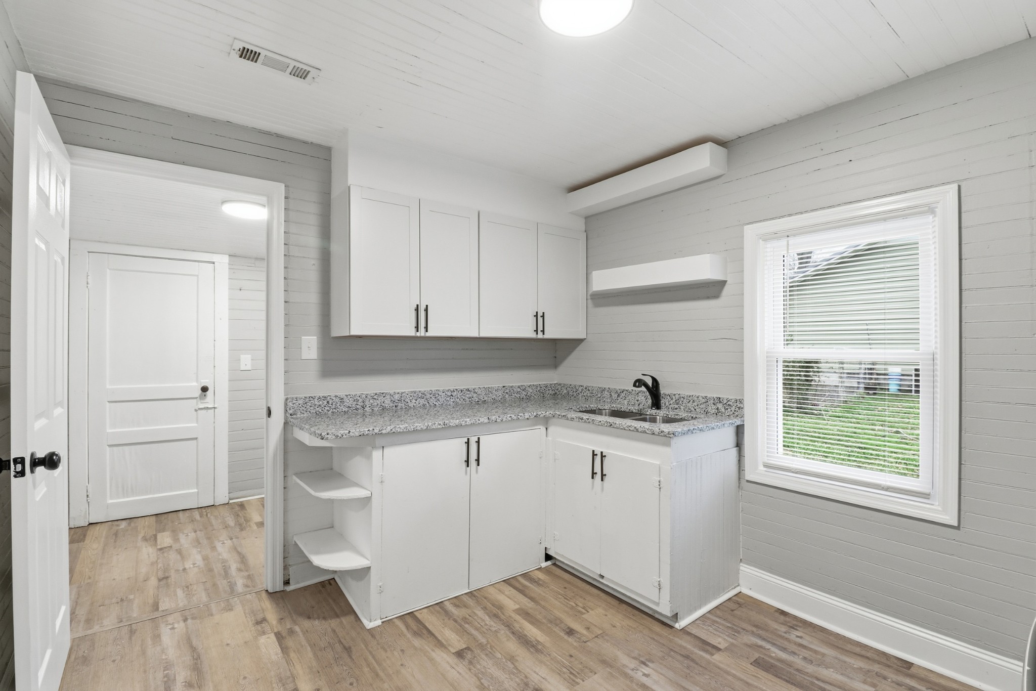 612 Maple Street Manchester, TN 37355 - Photo 15 of 20 a kitchen with a sink cabinets and wooden floor