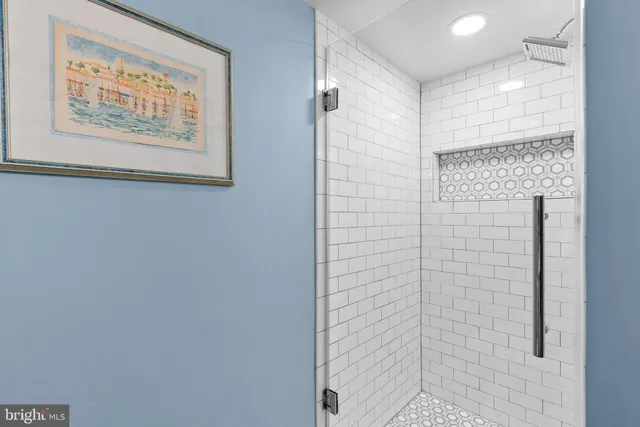 a bathroom with a shower and a shower