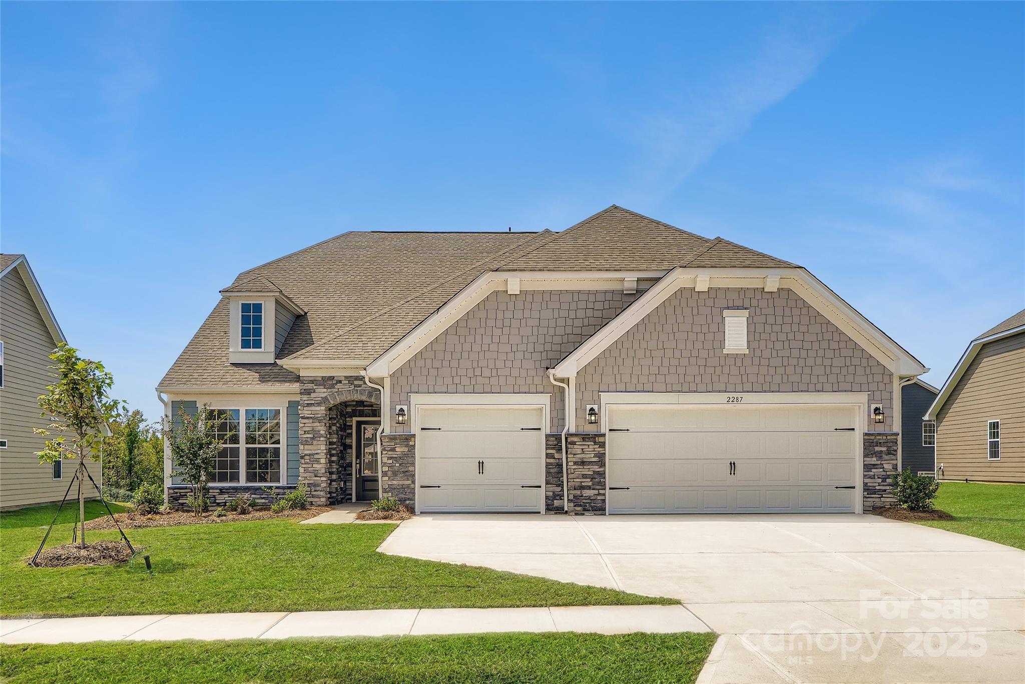 a front view of a house with a yard