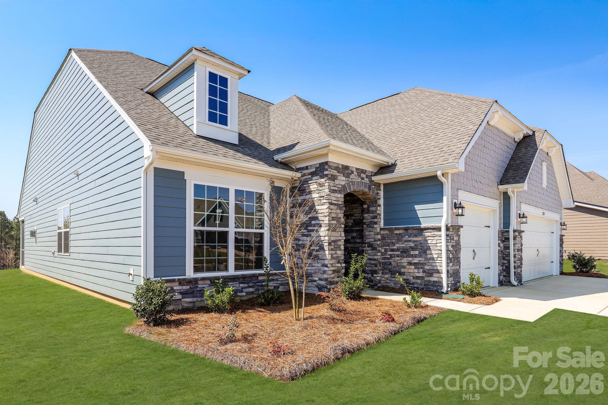 2287 Moon Crst Road, Unit 143 Lancaster, SC 29720 - Photo 2 of 35 a front view of a house with a yard