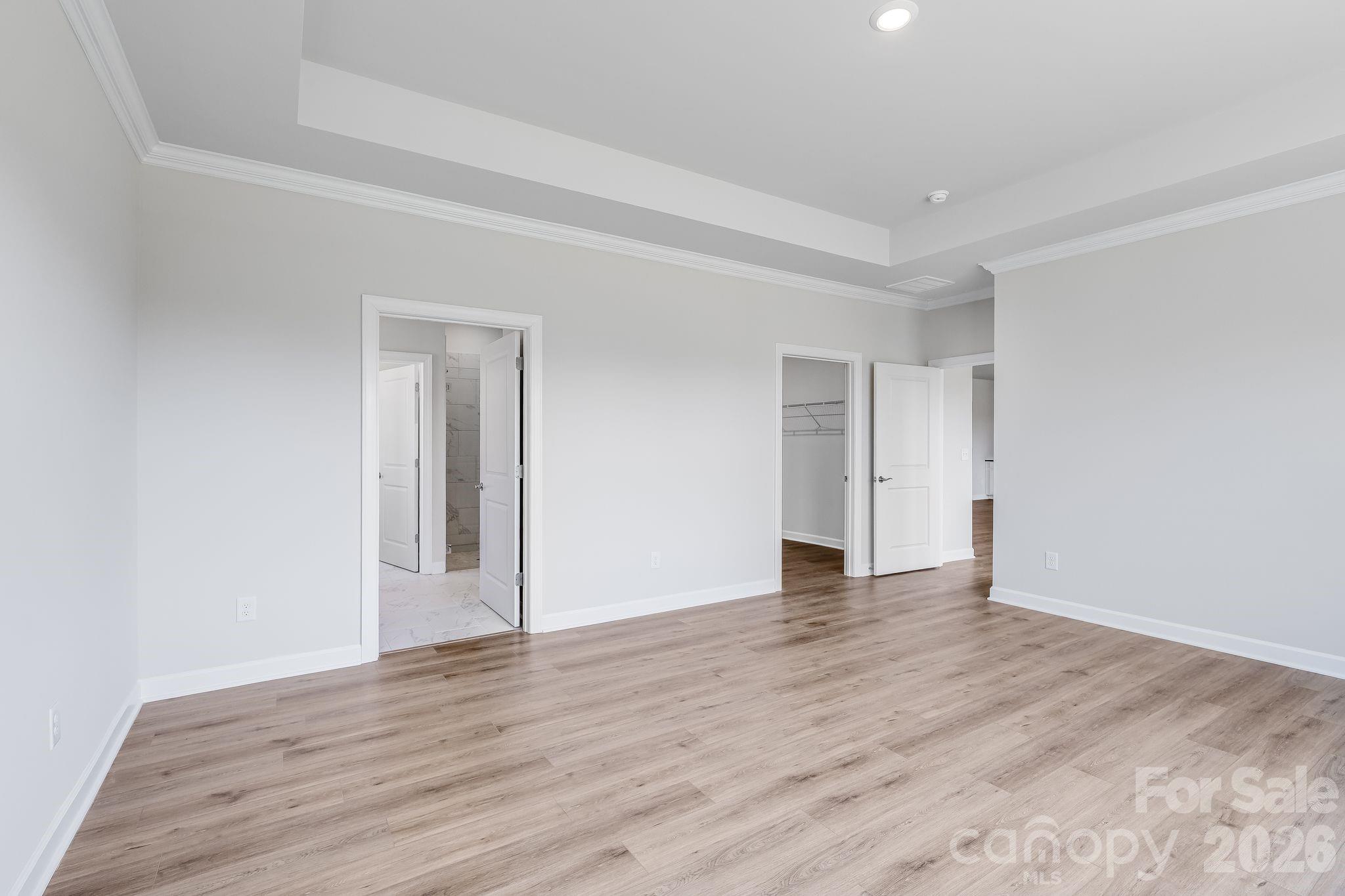 2287 Moon Crst Road, Unit 143 Lancaster, SC 29720 - Photo 24 of 35 a view of an empty room with wooden floor and closet