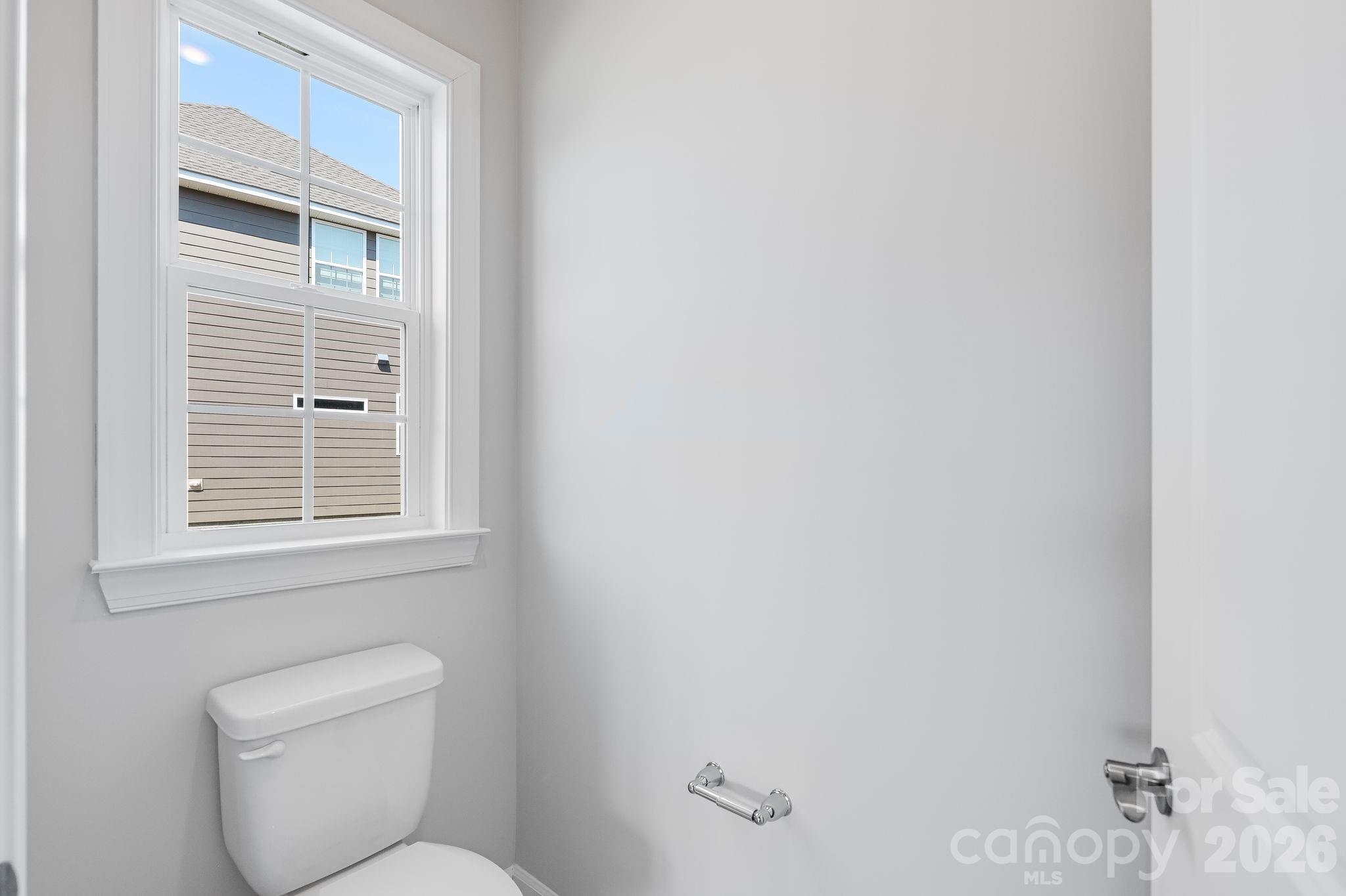 2287 Moon Crst Road, Unit 143 Lancaster, SC 29720 - Photo 26 of 35 a bathroom with a toilet a window and a shower