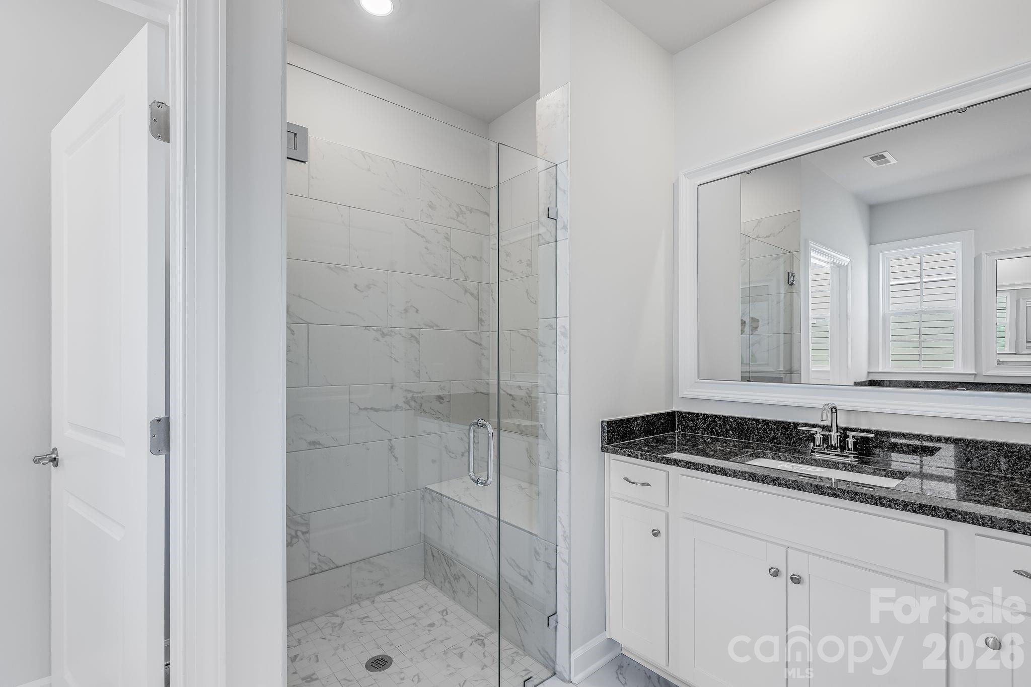 2287 Moon Crst Road, Unit 143 Lancaster, SC 29720 - Photo 27 of 35 a bathroom with a sink and a mirror