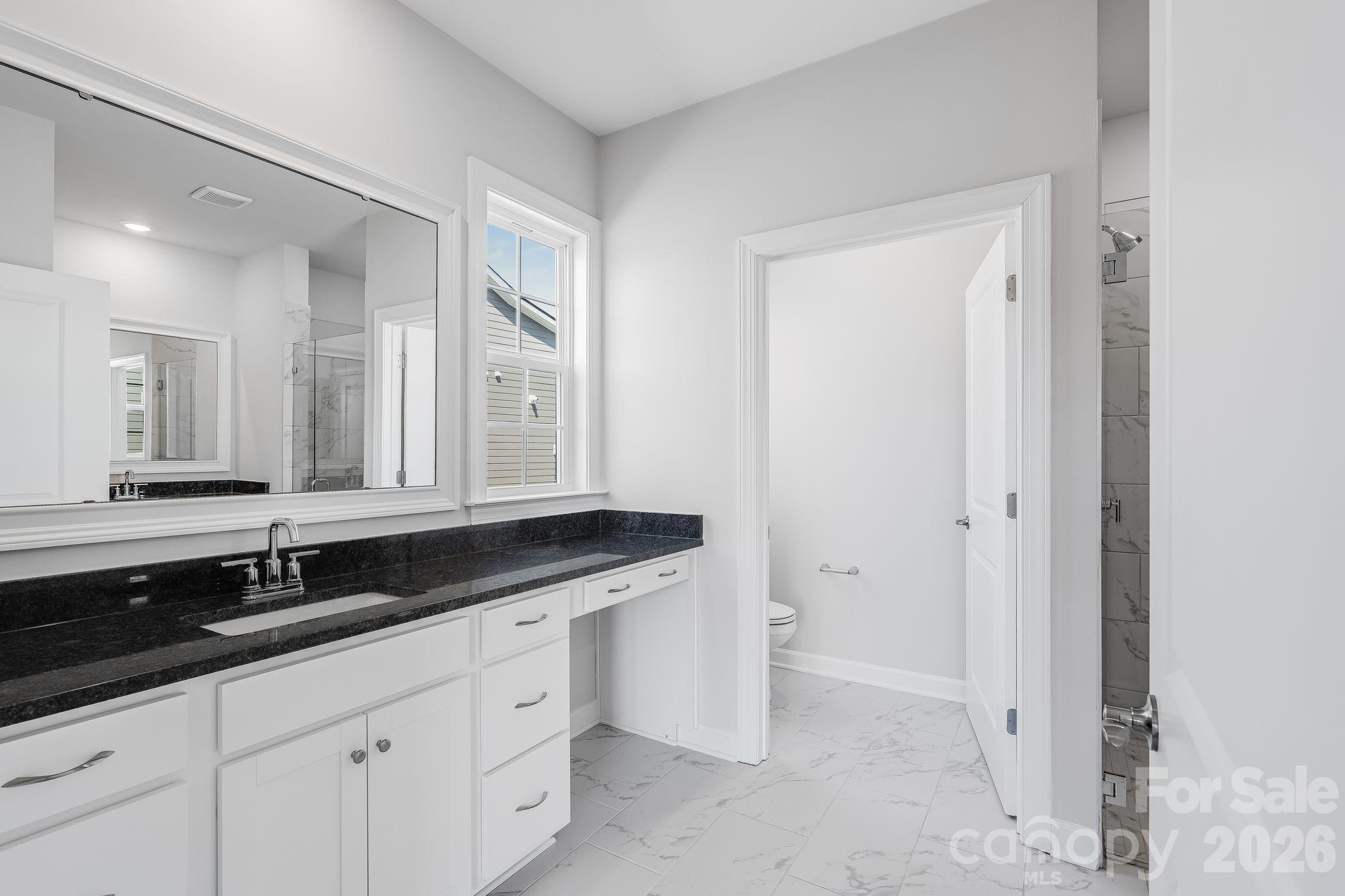 2287 Moon Crst Road, Unit 143 Lancaster, SC 29720 - Photo 28 of 35 a bathroom with a granite countertop sink and a mirror