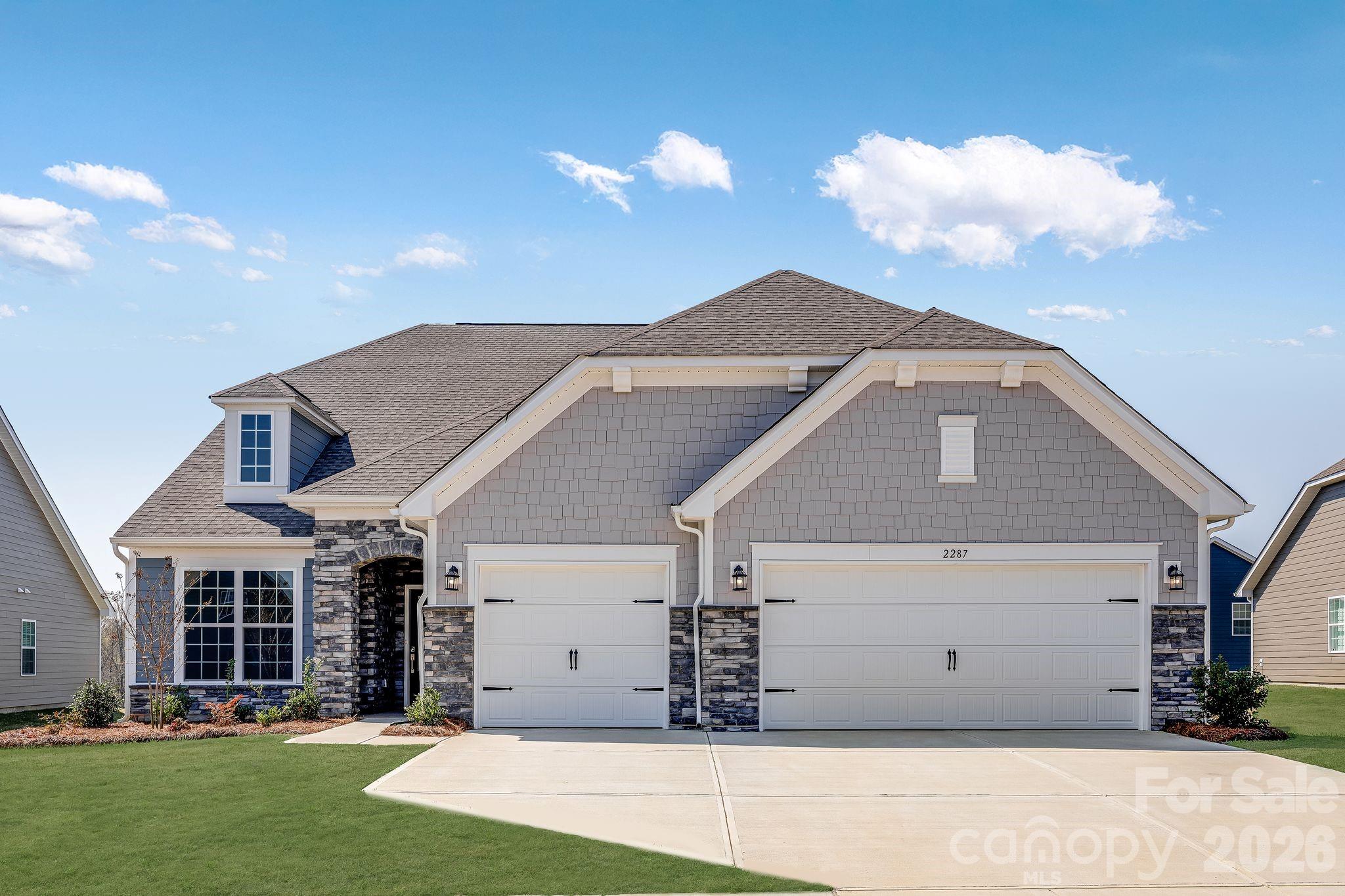 2287 Moon Crst Road, Unit 143 Lancaster, SC 29720 - Photo 3 of 35 a front view of house with a garden