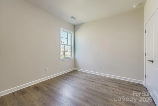 a bathroom with a granite countertop sink toilet a mirror and shower