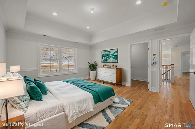 a bedroom with a large bed and a couch