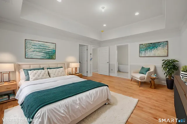 a spacious bathroom with 2 sink bathtub and window