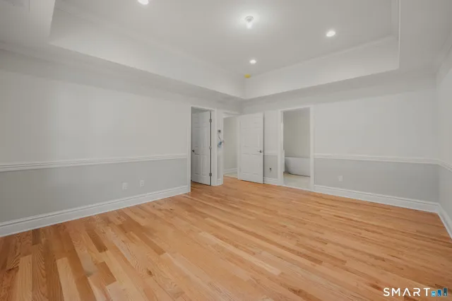 a bathroom with a shower a toilet and a shower