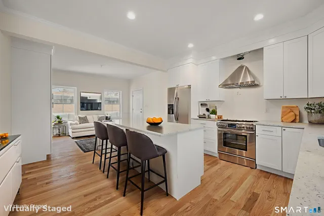 a view of kitchen with wooden floor