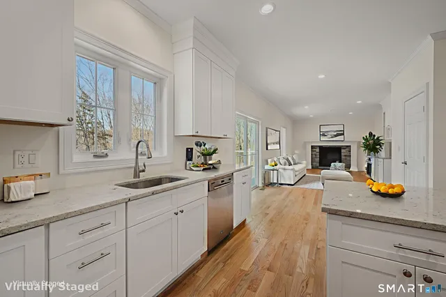 a view of deck with wooden floor and fence with trees