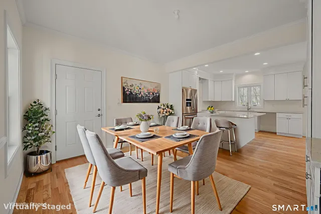 a bedroom with a bed and a table