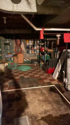 a room with lots of appliances and cabinets