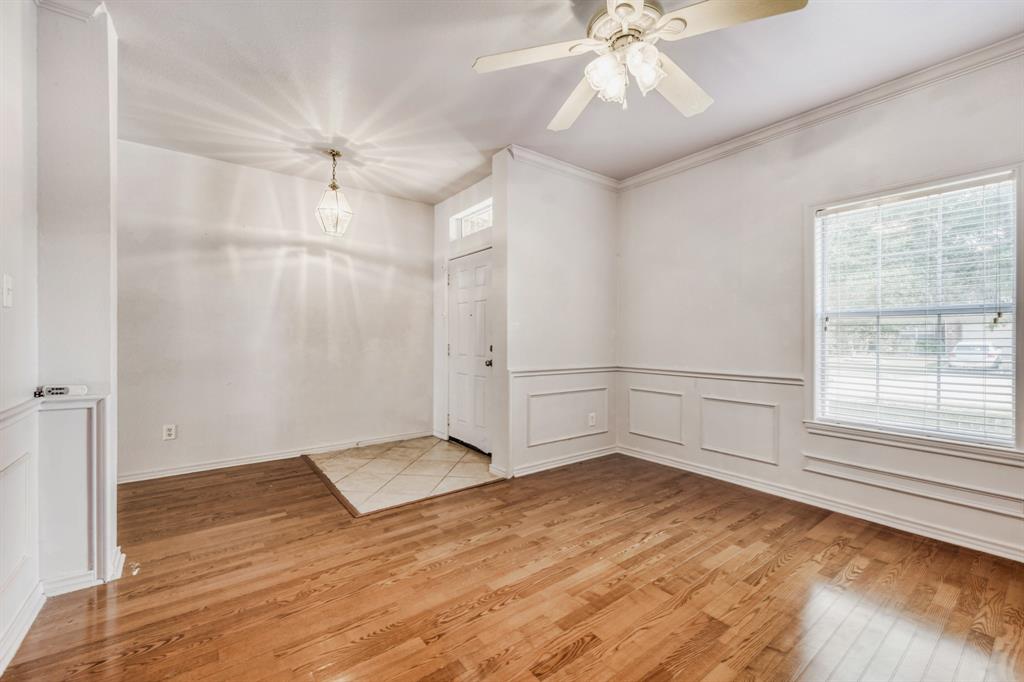 2617 Hereford Road Denton, TX 76210 - Photo 13 of 27 wooden floor in an empty room with a window