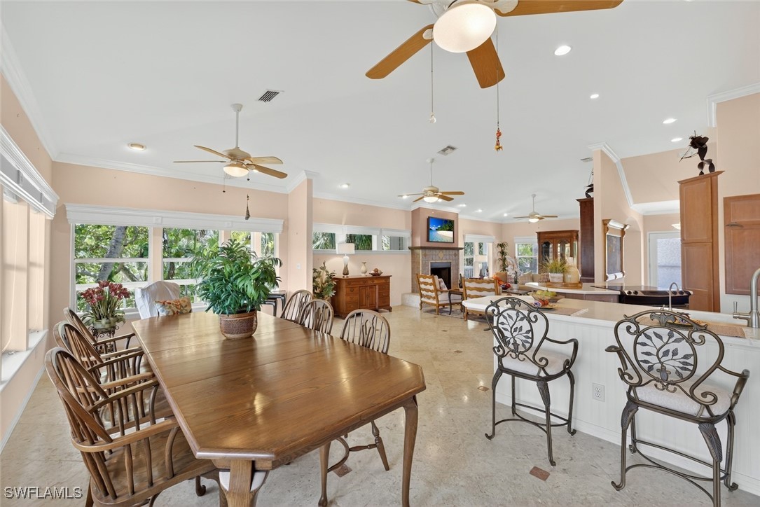 6120 Henderson Road Sanibel, FL 33957 - Photo 11 of 50 a view of a dining room with furniture window and outside view