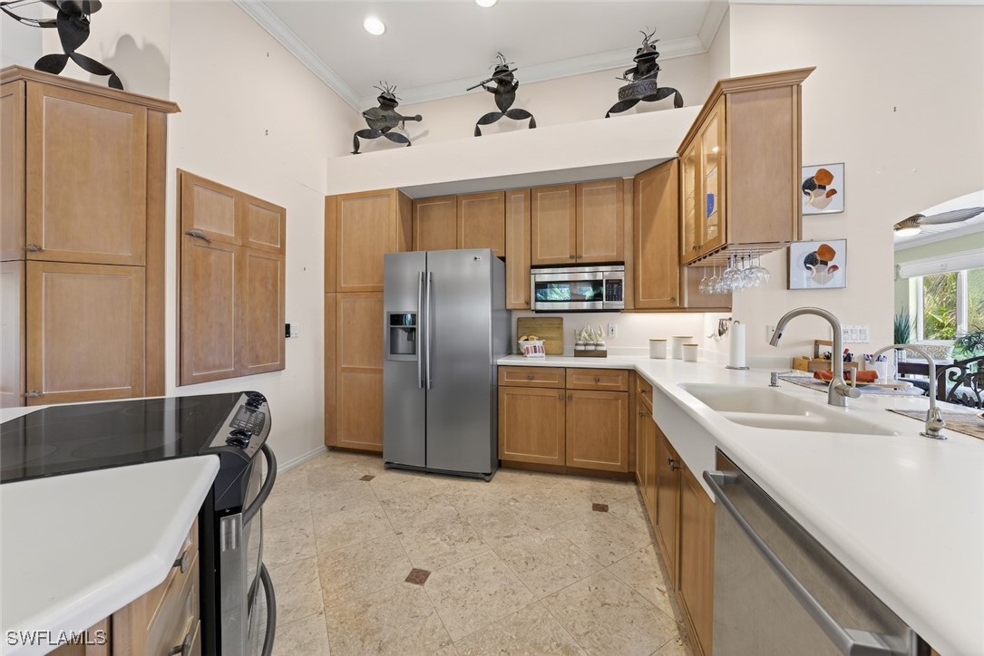6120 Henderson Road Sanibel, FL 33957 - Photo 15 of 50 a kitchen with refrigerator cabinets and wooden furniture
