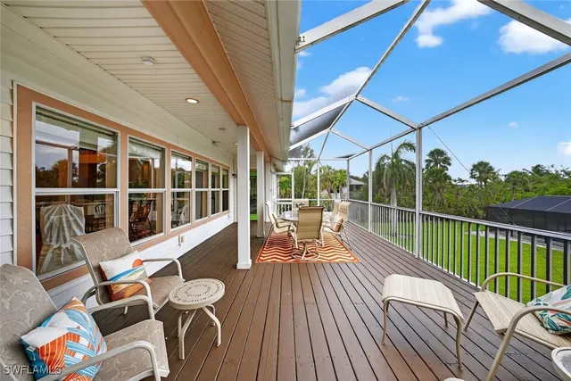 a view of a chair and tables in the balcony