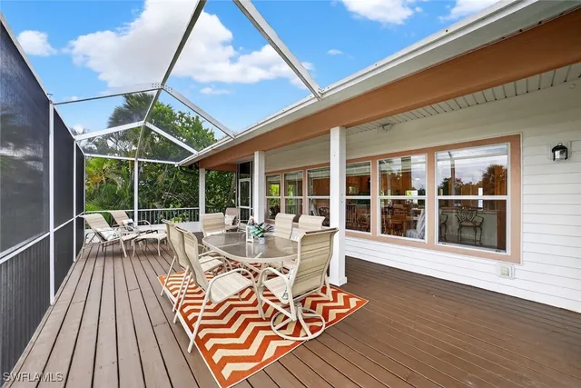 a view of balcony with chairs and wooden floor