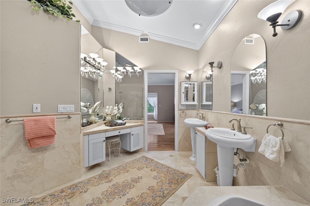 6120 Henderson Road Sanibel, FL 33957 - Photo 27 of 50 a large white kitchen with a sink and dishwasher