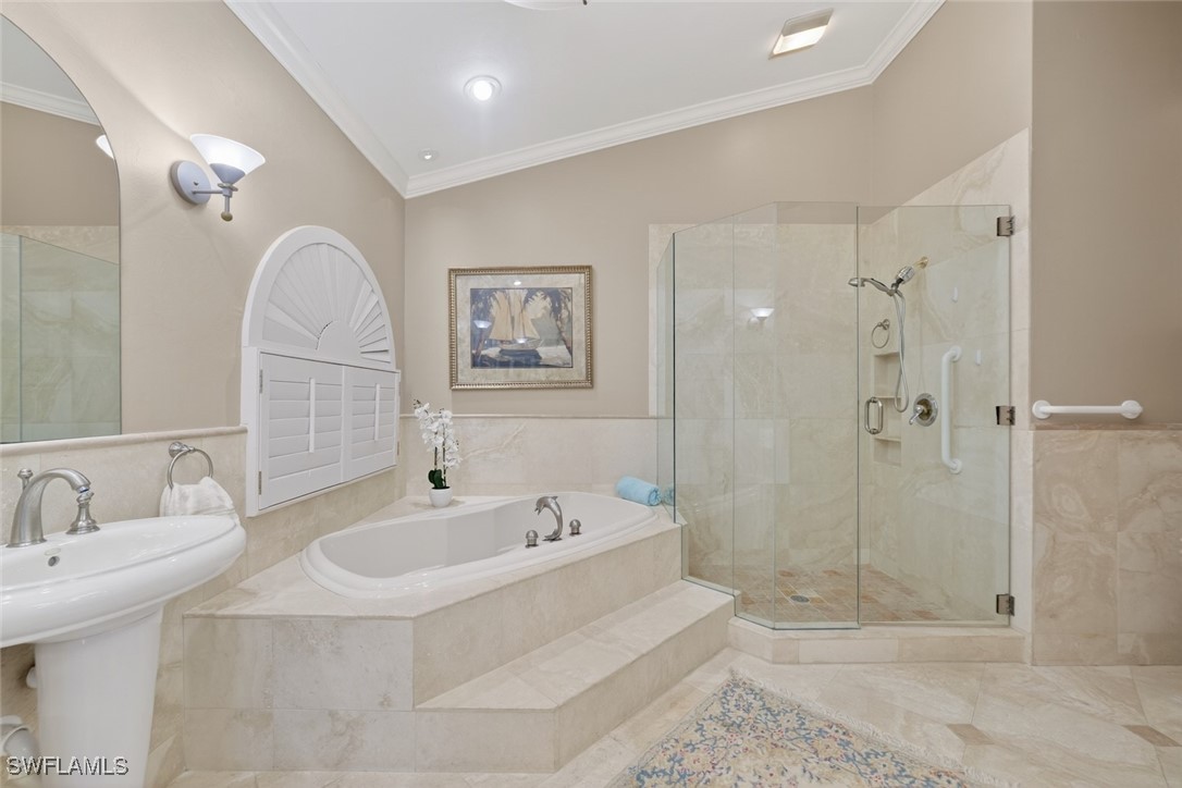 6120 Henderson Road Sanibel, FL 33957 - Photo 28 of 50 a bathroom with a sink a toilet and shower
