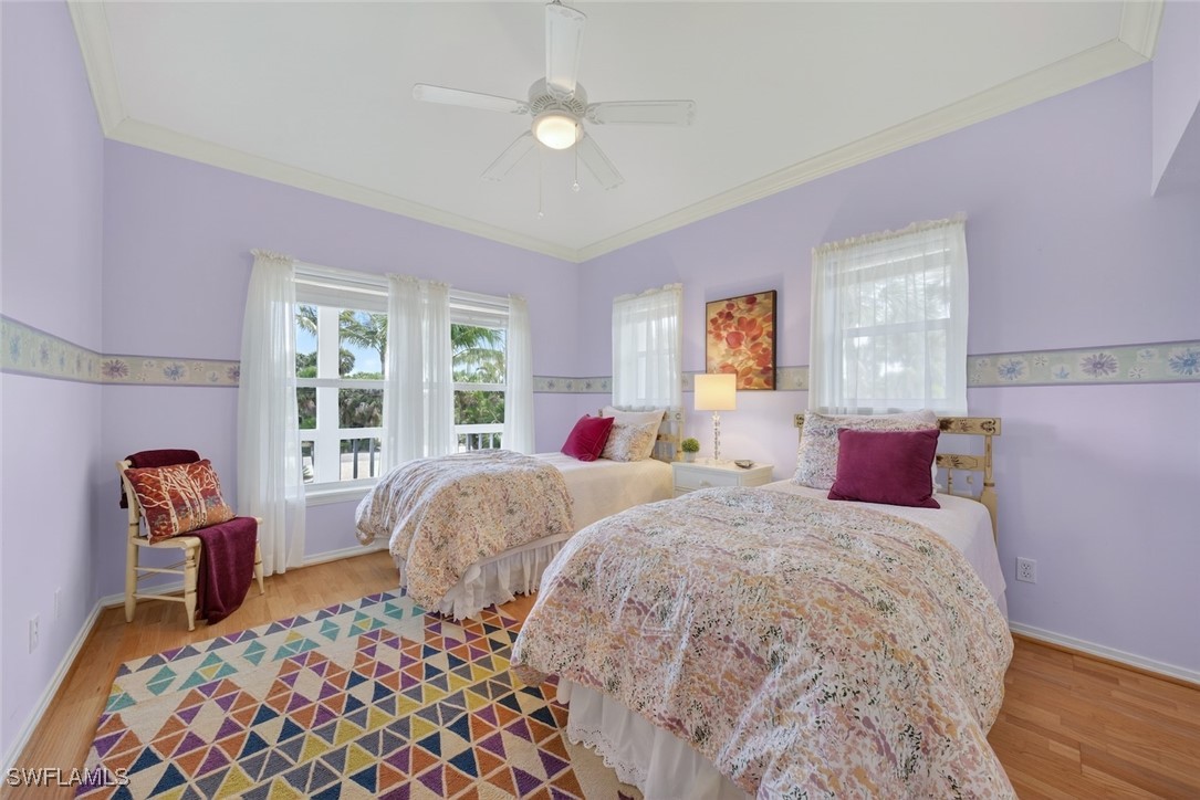 6120 Henderson Road Sanibel, FL 33957 - Photo 34 of 50 a bedroom with double bed and a window