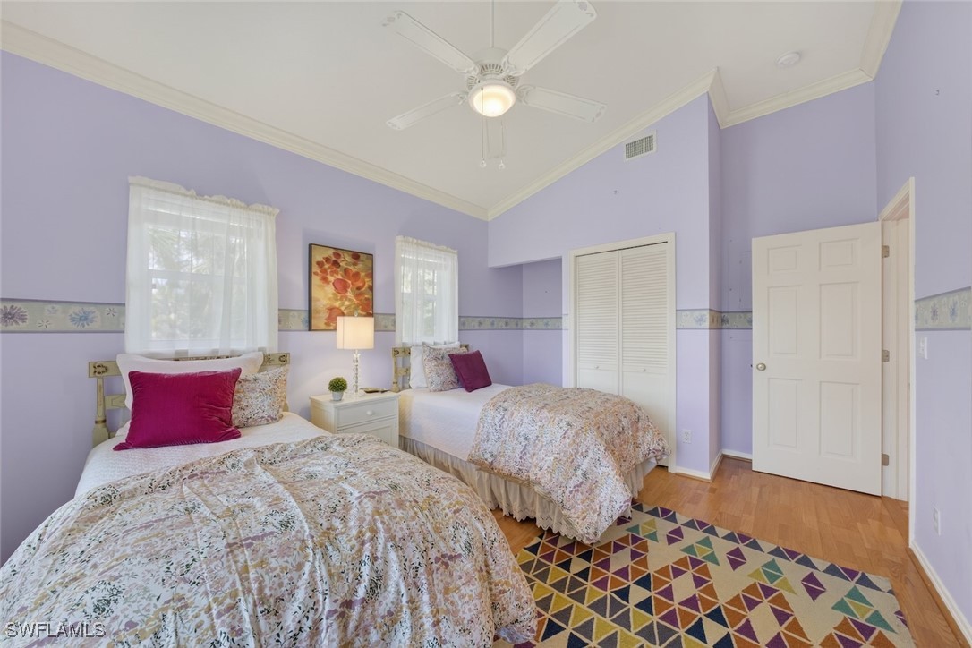 6120 Henderson Road Sanibel, FL 33957 - Photo 35 of 50 a bedroom with two beds and a dresser