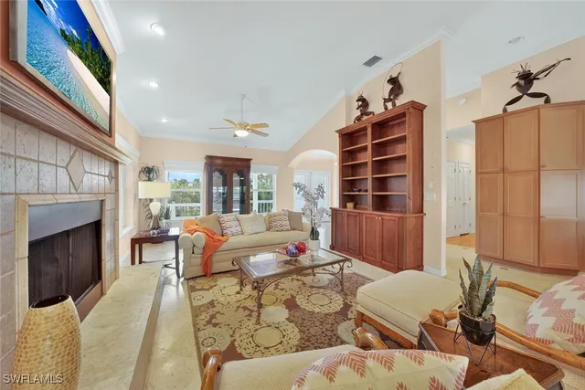 a living room with furniture fireplace and window