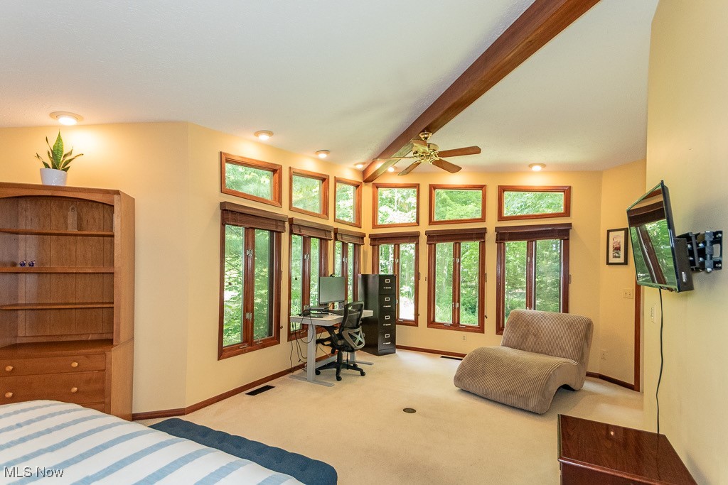 33 Woodside Road Chagrin Falls, OH 44022 - Photo 23 of 48 Bedroom featuring beamed ceiling, an office area, and carpet floors