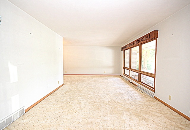 6929 Spring Brook Road Rockford, IL 61114 - Photo 4 of 17 a view of an empty room and window