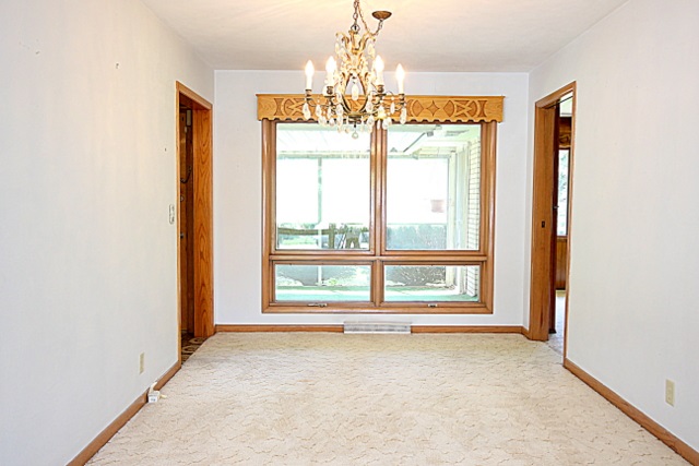 6929 Spring Brook Road Rockford, IL 61114 - Photo 5 of 17 a view of an empty room with a window