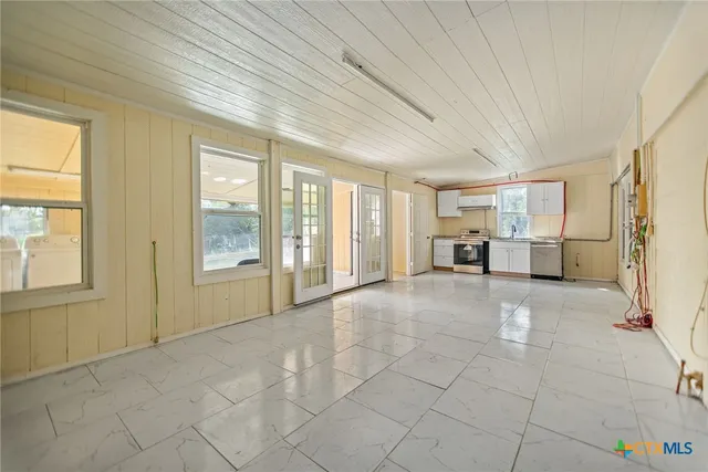 a view of an empty room with a window