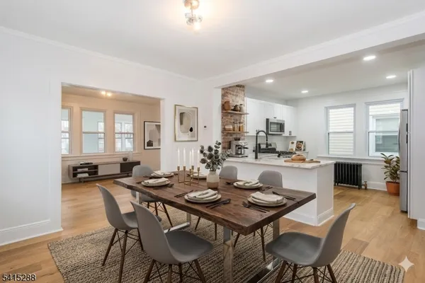 a view of a dining room with furniture and window