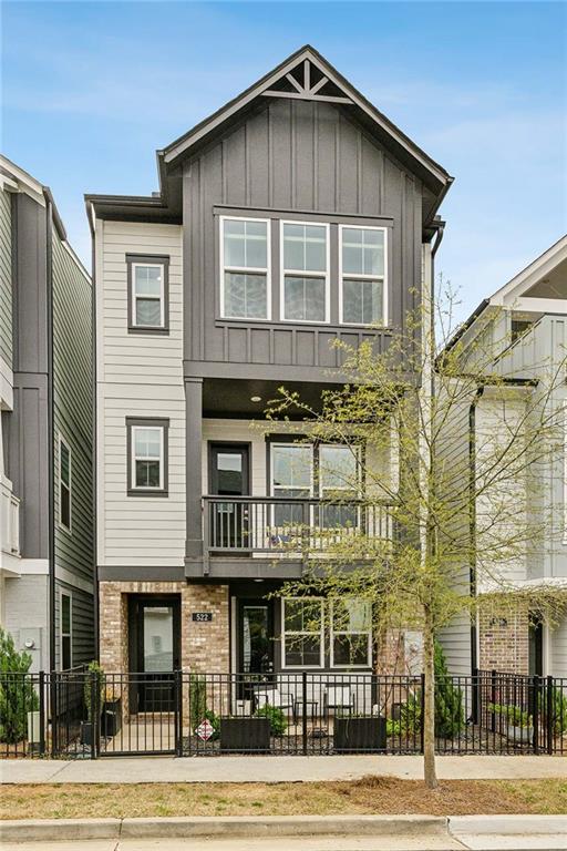 a front view of a residential apartment building with a yard