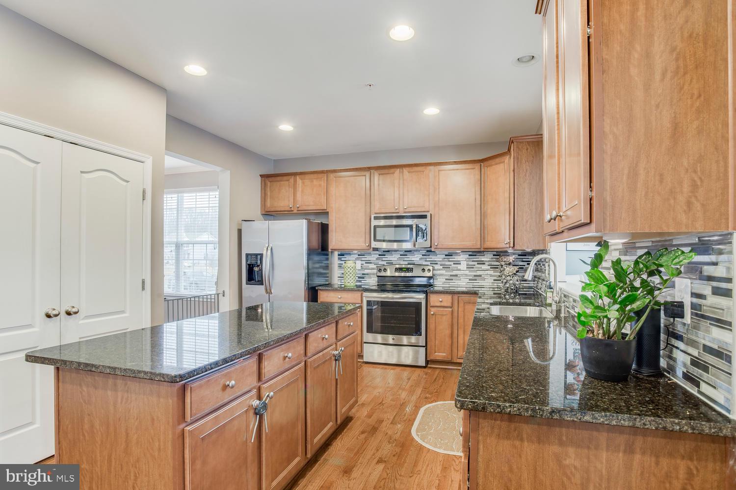 705 Bischoff Road Baltimore, MD 21220 - Photo 12 of 45 Kitchen features large pantry closet and island