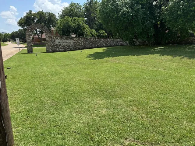 a view of yard with swimming pool and seating
