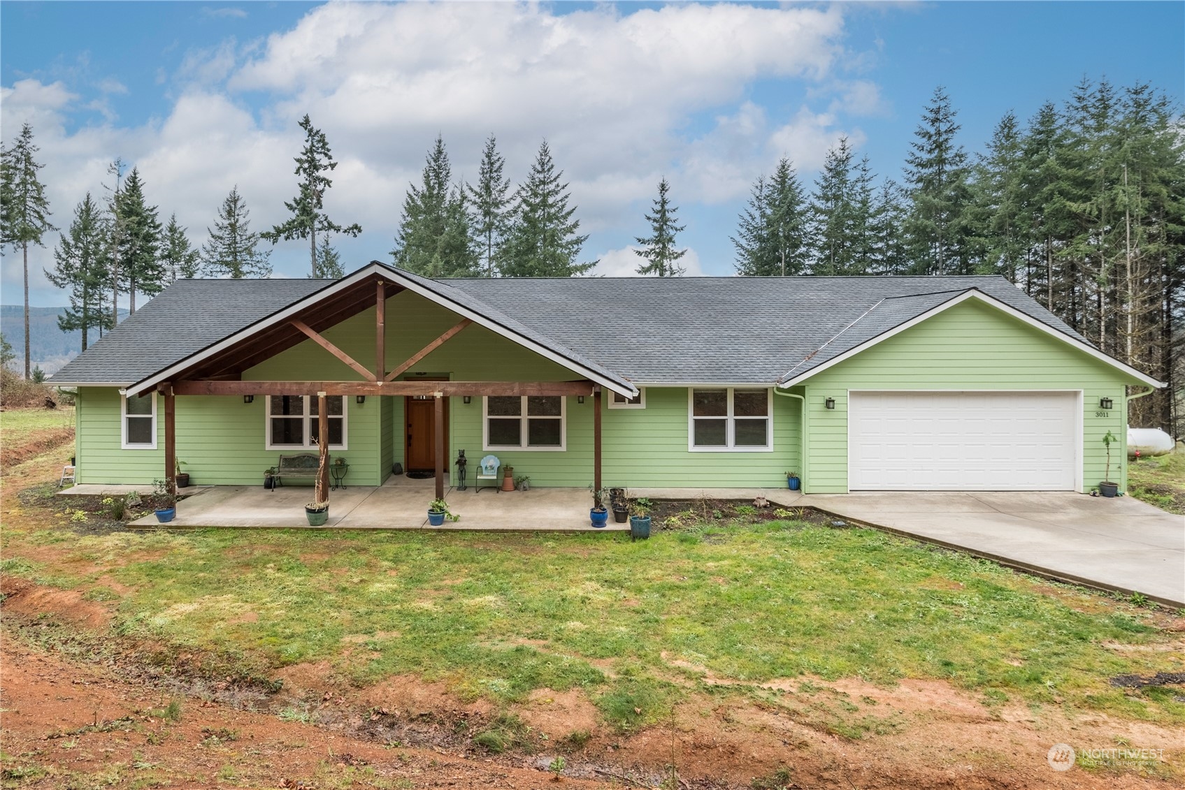 3011 Stella Road Longview, WA 98632 - Photo 1 of 38 a house with trees in the background