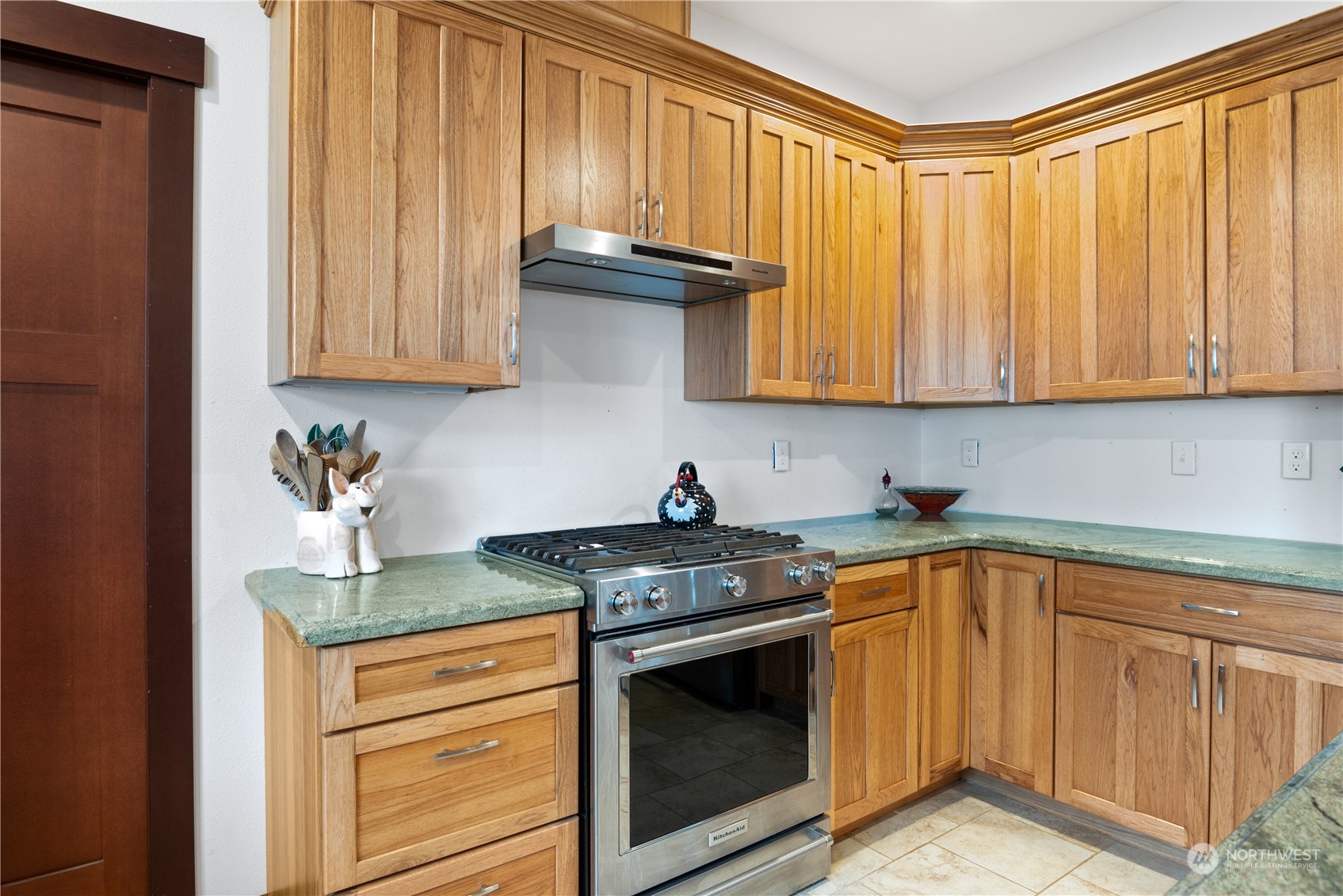 3011 Stella Road Longview, WA 98632 - Photo 15 of 38 a kitchen with granite countertop cabinets stainless steel appliances and a sink
