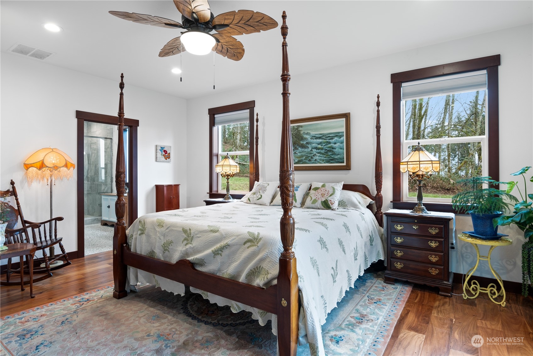 3011 Stella Road Longview, WA 98632 - Photo 19 of 38 a bed room with a bed a chandelier and a window