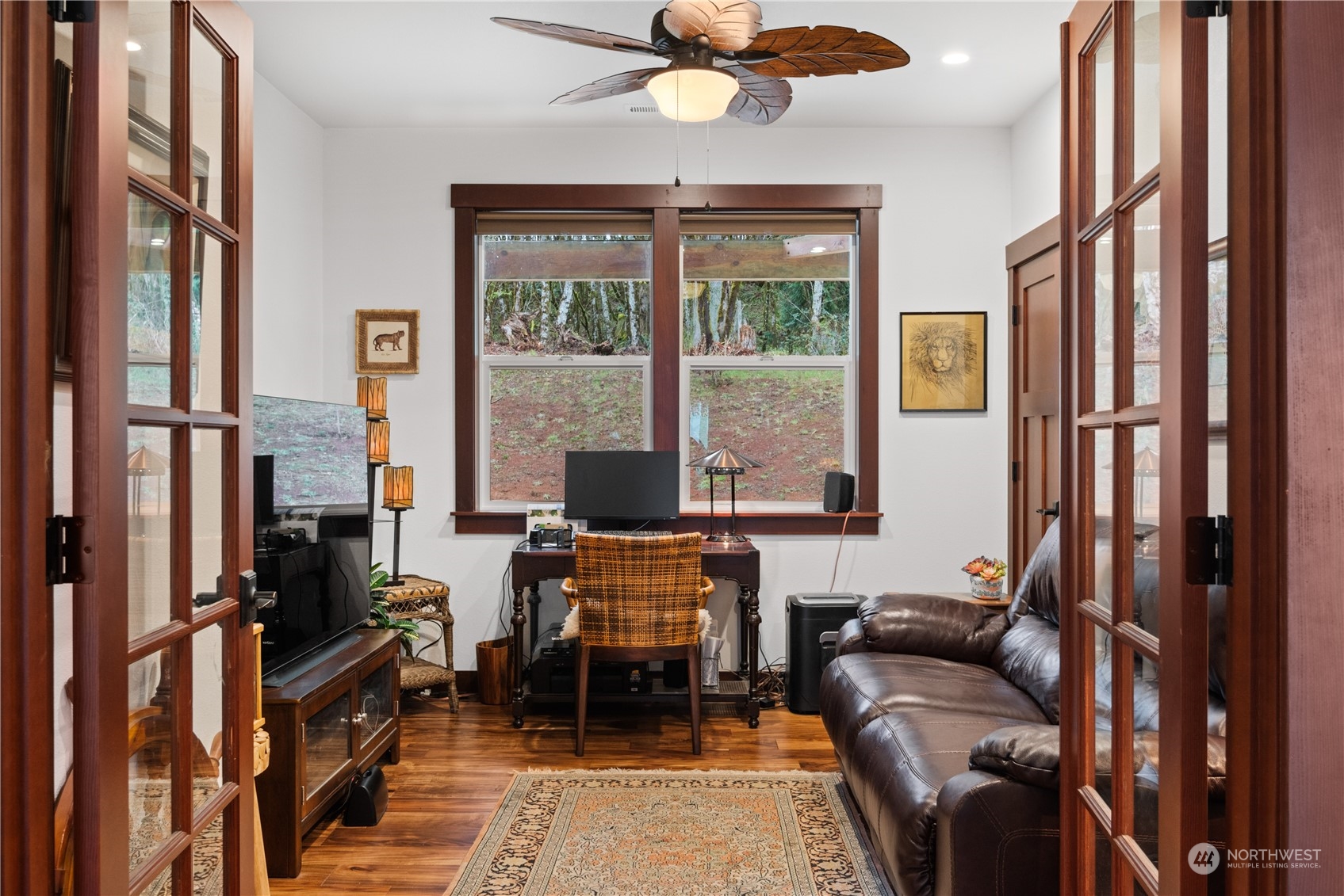 3011 Stella Road Longview, WA 98632 - Photo 22 of 38 a living room with furniture a fireplace and a window