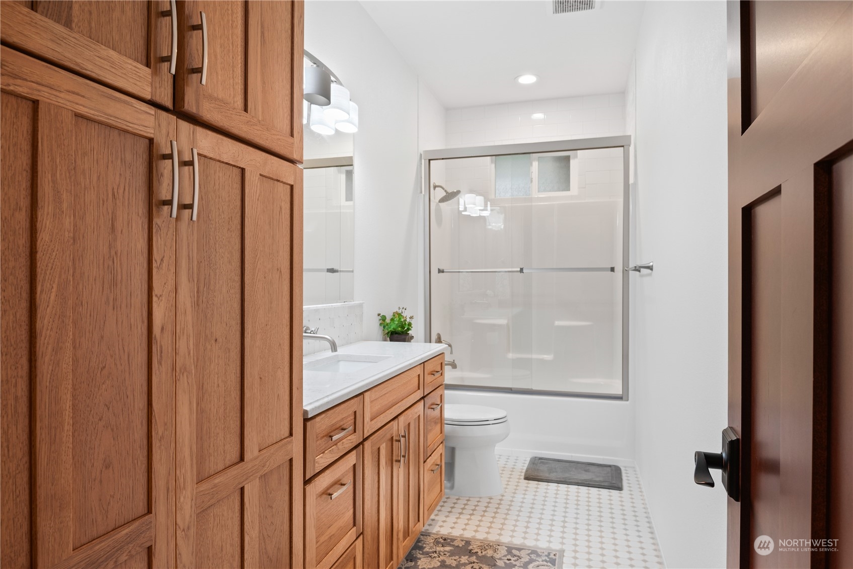 3011 Stella Road Longview, WA 98632 - Photo 24 of 38 a bathroom with a granite countertop sink a toilet and shower