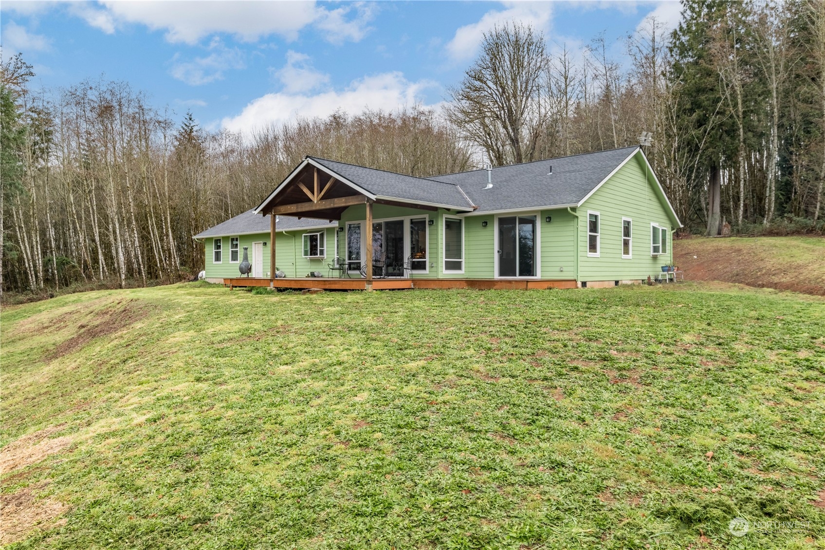 3011 Stella Road Longview, WA 98632 - Photo 33 of 38 a front view of a house with a garden and trees