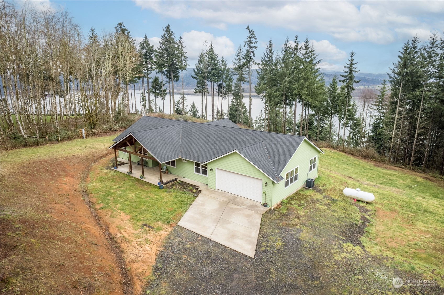 3011 Stella Road Longview, WA 98632 - Photo 35 of 38 an aerial view of a house with garden space and trees all around
