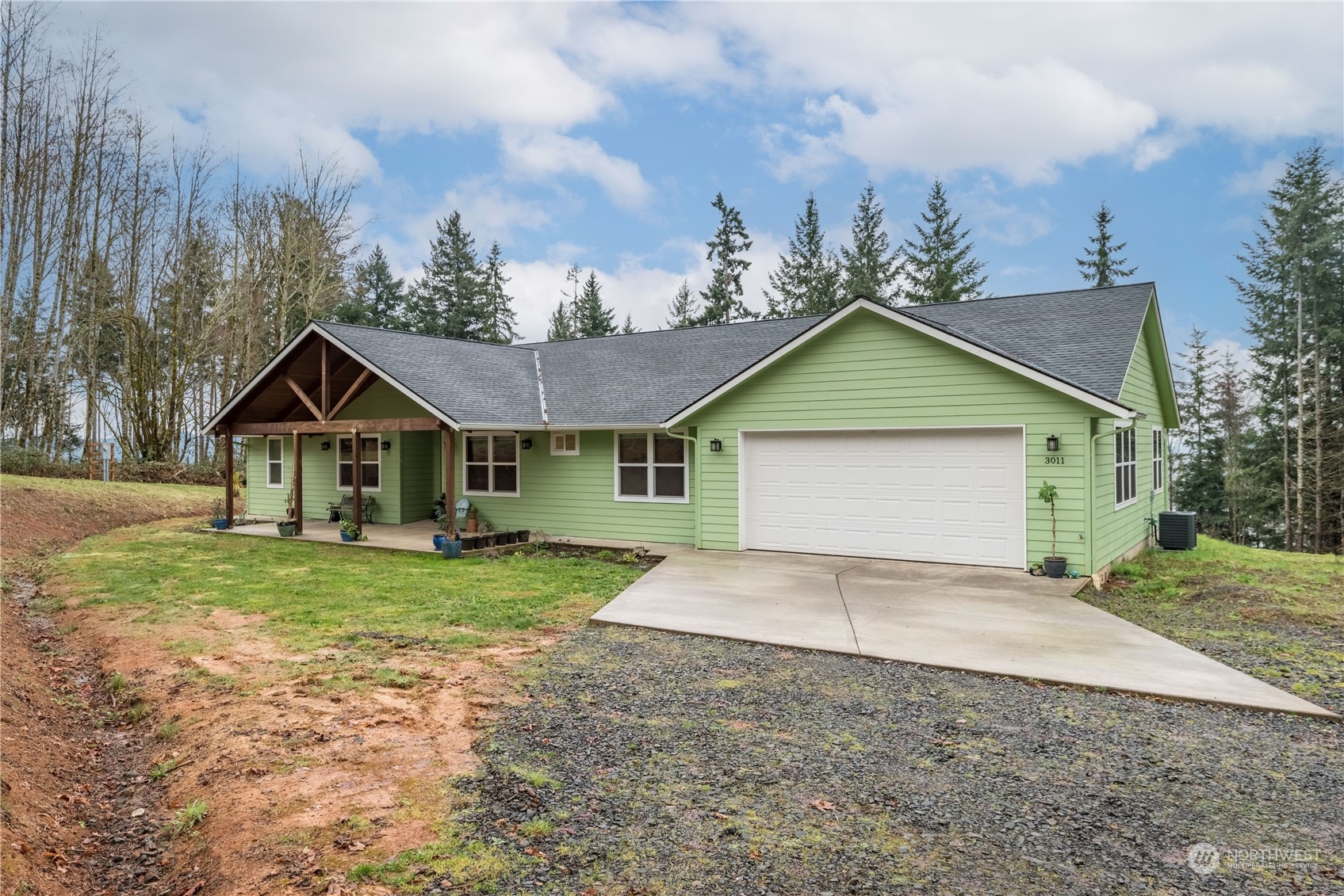 3011 Stella Road Longview, WA 98632 - Photo 4 of 38 a front view of a house with a yard and garage