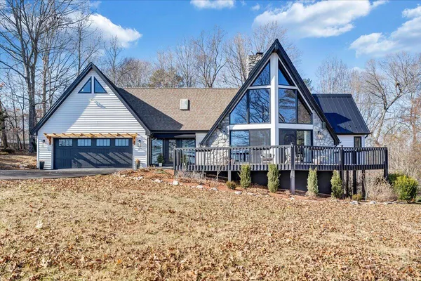 a view of a house with a snow in the yard