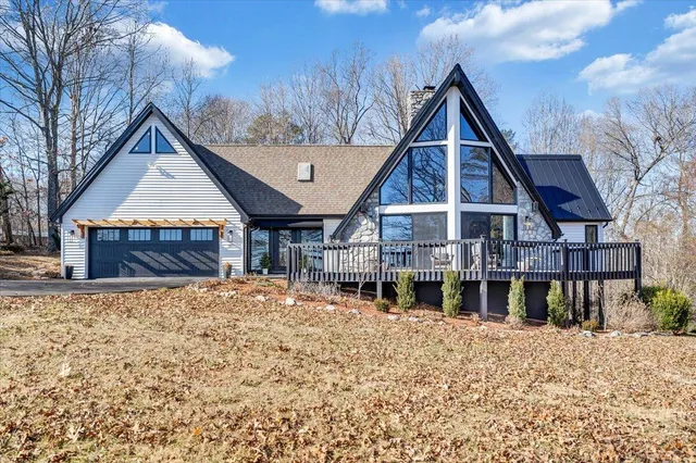 a view of a house with a snow in the yard