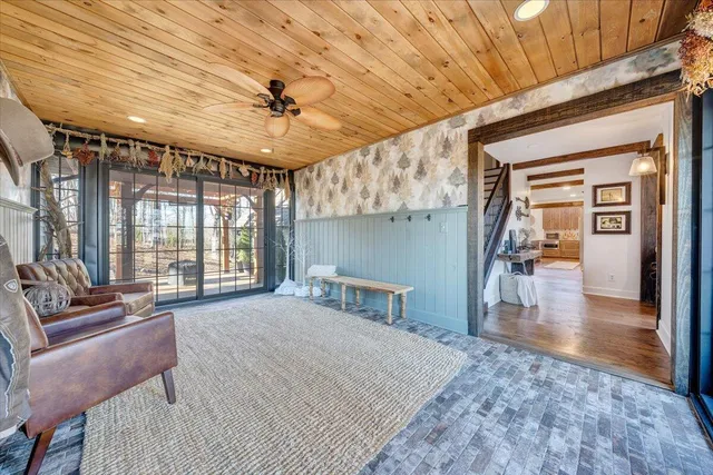 a view of a bedroom with furniture and chandelier
